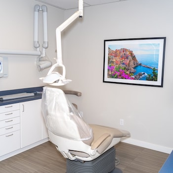 Inside of a dental treatment room with a dental treatment chair